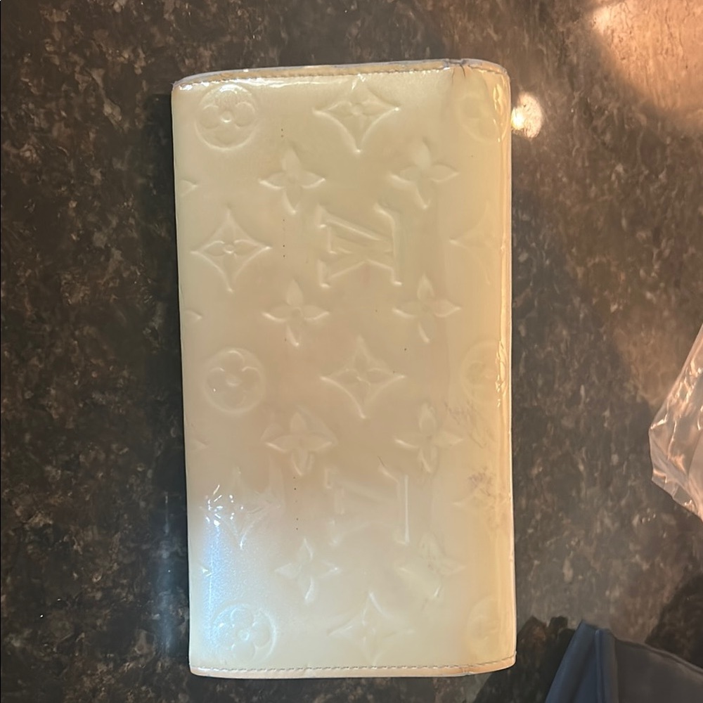 Louis Vuitton cream wallets